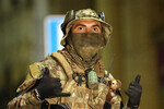 Боец ЧВК «Вагнер» на улице города, 24 июня 2023 года