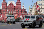Бронеавтомобиль «Патруль» (на переднем плане), бронеавтомобиль «Урал-432009» (на втором плане) в составе войск Росгвардии на Красной площади во время военного парада, посвященного 73-й годовщине Победы в Великой Отечественной войне, 9 мая 2018 года