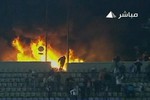 Кадр с картинкой одного из местных телеканалов, показывающий пожар на арене