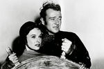 Полетт Годдар и Джон Уэйн в фильме «Пожнешь бурю» (1942)