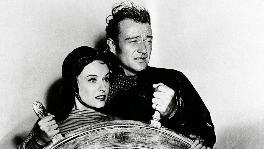 Полетт Годдар и Джон Уэйн в фильме «Пожнешь бурю» (1942)
