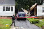 Автомобиль, поврежденный в&nbsp;результате крушения самолета на&nbsp;жилые дома в&nbsp;городе Ист-Хейвен