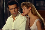 <b>«Ох уж эта девчонка!» (1956)</b>
<br><br>
Сценарий для романтической комедии написал Роже Вадим — к тому моменту уже супруг Брижит Бардо. В проекте она сыграла девушку по имени Брижит, дочь владельца ночного клуба, оставленную на попечение управляющему заведения Жану, пока отец уехал в Швейцарию по серьезному делу. Девица создает временному опекуну массу проблем, включая пожар в квартире и разлад с невестой. Но в конце концов Брижит и Жан полюбят друг друга.
<br>
Сюжет ленты, как рассказывал Вадим, был придуман специально под Бардо.