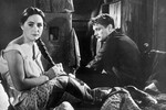 В июне 1941 года он отправился на фронт, где его взяли в плен. Лебедев трижды пытался сбежать, каждый раз неудачно.
<br><br>На фото: актеры Людмила Хитяева и Николай Лебедев в сцене фильма «Евдокия», 1961 год