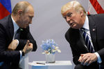 Владимир Путин и Дональд Трамп во время встречи на саммите G20 в Гамбурге