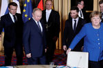 Президент Франции Эммануэль Макрон, президент России Владимир Путин, президент Украины Владимир Зеленский и канцлер Германии Ангела Меркель во время встречи в рамках саммита «нормандского формата» в Елисейском дворце, 9 декабря 2019 года