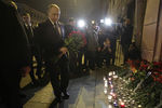 Russian president Vladimir Putin puts flowers down outside Tekhnologicheskiy Institut metro station in St. Petersburg, Russia, April 3, 2017. REUTERS/