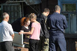 Оперативно-следственные мероприятия на месте массового убийства в одном из частных домов города