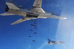Бомбардировщики-ракетоносцы Ту-22 Дальней авиации Военно-космических сил России во время нанесения удара по объектам террористической группировки ИГ (организация запрещена на территории РФ) 