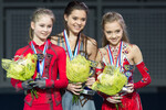 Призеры чемпионата России по фигурному катанию в Сочи в женском одиночном катании на церемонии награждения. Слева направо: Юлия Липницкая, завоевавшая серебряную медаль, Аделина Сотникова, завоевавшая золотую медаль, и Елена Радионова, завоевавшая бронзовую медаль, 2013 год 