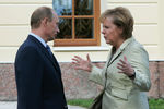 Владимир Путин и Ангела Меркель перед началом рабочей встречи глав государств на саммите G8, 2006 год
