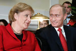 Ангела Меркель и Владимир Путин во время встречи в Томске, 2006 год