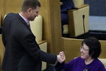 MOSCOW, RUSSIA. FEBRUARY 20, 2015. Sergei Furgal (L) and Saliya Murzabayeva, members of Russia's State Duma healthcare committee, talking at a State Duma meeting. Artyom Korotayev/TASS
Россия. Москва. 20 февраля. Члены комитета Госдумы РФ по охране здоровья Сергей Фургал и Салия Мурзабаева на пленарном заседании Государственной Думы РФ, 2015 год