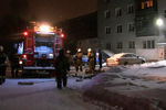 На месте пожара в девятиэтажном жилом доме в Екатеринбурге, 12 января 2021 года